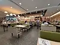 位於將軍澳日出康城商場，2021年開業的大家樂分店採用第六代懷舊設計